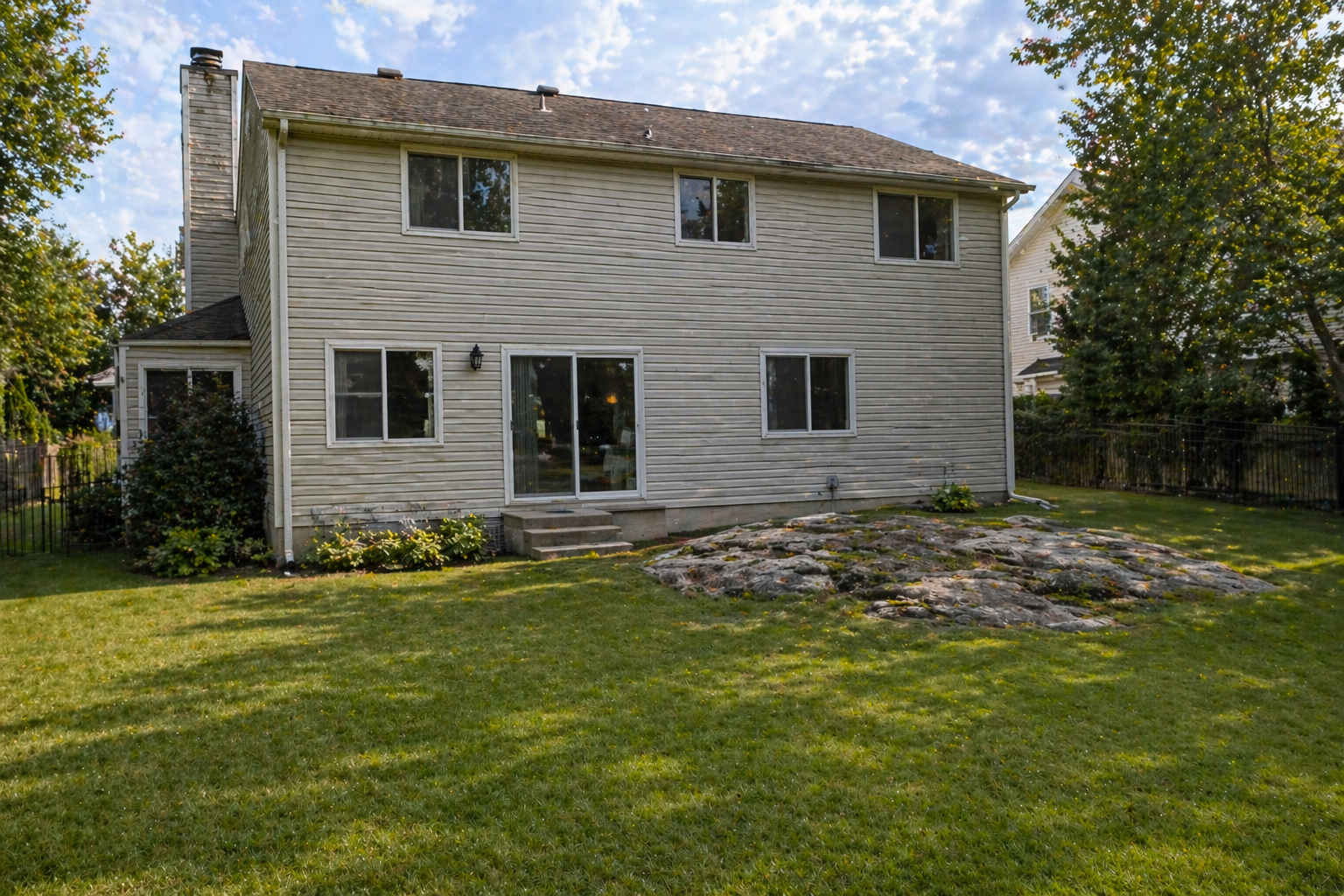 rock outcropping that limits outdoor living in Rockland County Backyard